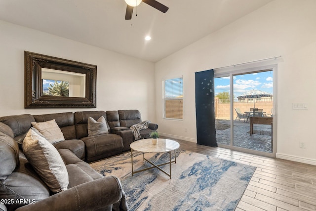 living room with vaulted ceiling and ceiling fan