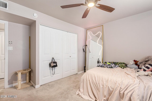 5913 E Thomas Rd, Scottsdale, AZ 85251 - bedroom featuring light colored carpet, a closet, a ceiling fan, and baseboards