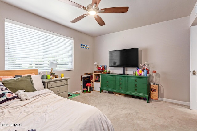 5913 E Thomas Rd, Scottsdale, AZ 85251 - carpeted bedroom featuring baseboards and a ceiling fan