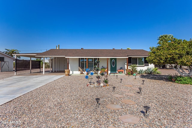 view of front facade with a carport