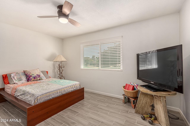 bedroom featuring light hardwood / wood-style floors and ceiling fan