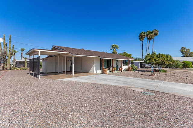 view of front of house featuring a carport