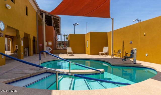 view of swimming pool featuring a patio