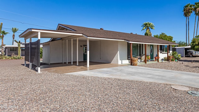 view of front of home with a carport