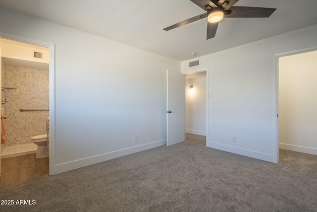 unfurnished bedroom with carpet floors, connected bathroom, and ceiling fan