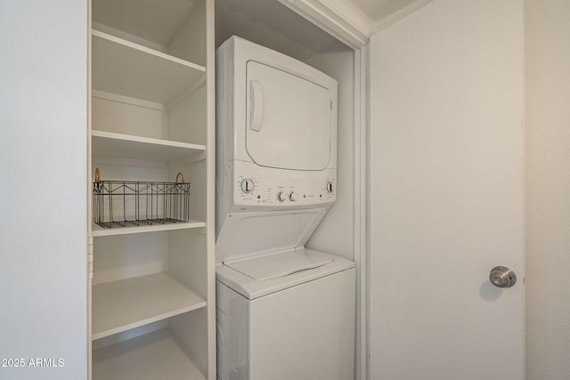 washroom with stacked washer and clothes dryer