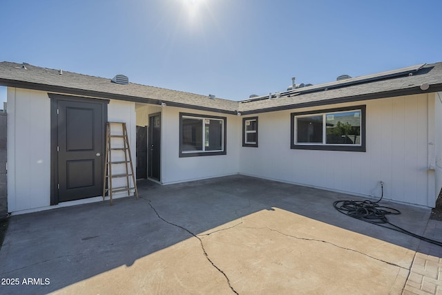 back of property with a patio area