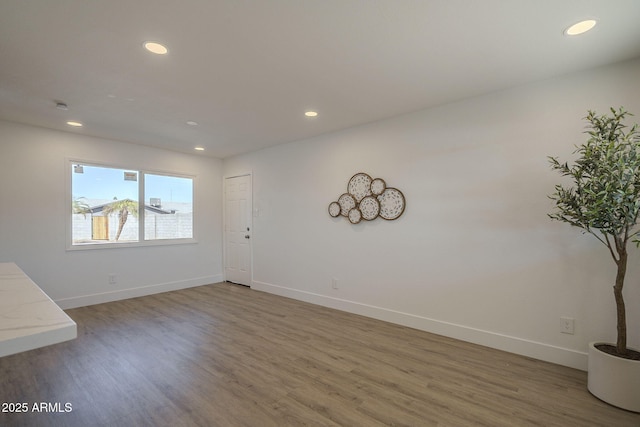 empty room with wood-type flooring