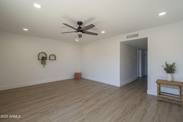 unfurnished room with ceiling fan and hardwood / wood-style floors