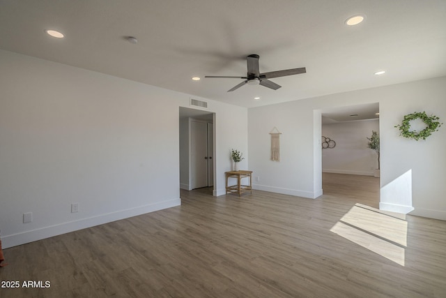 spare room with ceiling fan and light hardwood / wood-style flooring