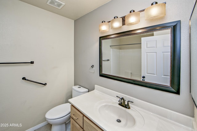 full bath featuring visible vents, toilet, baseboards, walk in shower, and vanity