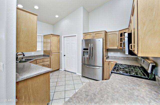 kitchen with light brown cabinets, recessed lighting, light tile patterned flooring, stainless steel appliances, and a sink