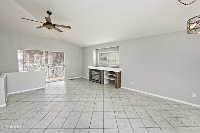 unfurnished living room with light tile patterned floors, baseboards, lofted ceiling, and a ceiling fan