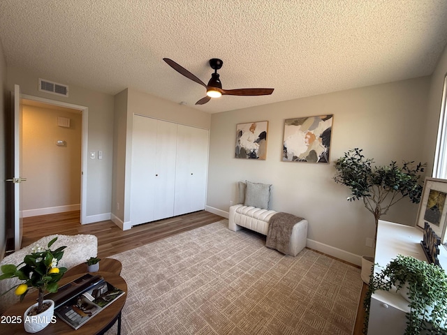 2337 E Manhatton Dr, Tempe, AZ 85282 - living area featuring a ceiling fan, wood finished floors, baseboards, and a textured ceiling