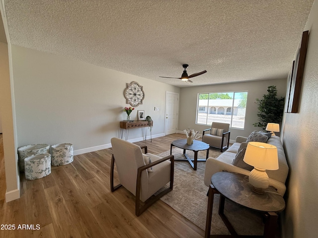 2337 E Manhatton Dr, Tempe, AZ 85282 - living room with wood finished floors, a ceiling fan, a textured ceiling, and baseboards
