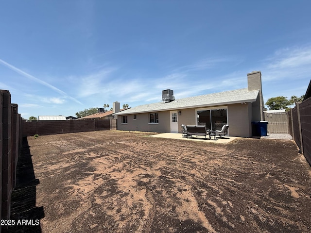 2337 E Manhatton Dr, Tempe, AZ 85282 - rear view of property featuring a fenced backyard, a patio, and a chimney