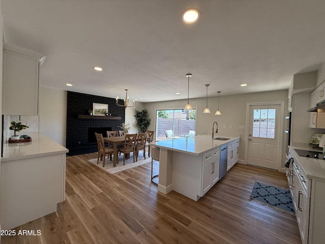 2337 E Manhatton Dr, Tempe, AZ 85282 - kitchen featuring a sink, dishwasher, light countertops, white cabinets, and recessed lighting