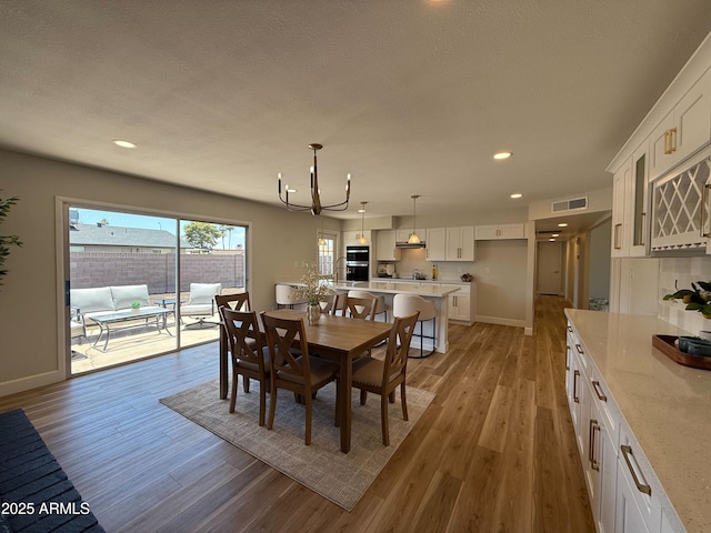 2337 E Manhatton Dr, Tempe, AZ 85282 - dining area featuring light wood-style floors, recessed lighting, a chandelier, and baseboards