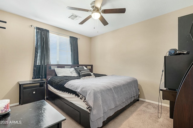 carpeted bedroom with ceiling fan, visible vents, and baseboards