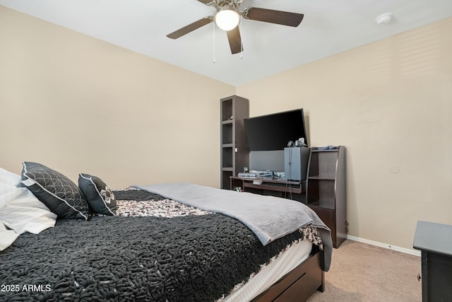 bedroom with ceiling fan, baseboards, and light colored carpet