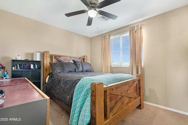 carpeted bedroom featuring ceiling fan, visible vents, and baseboards