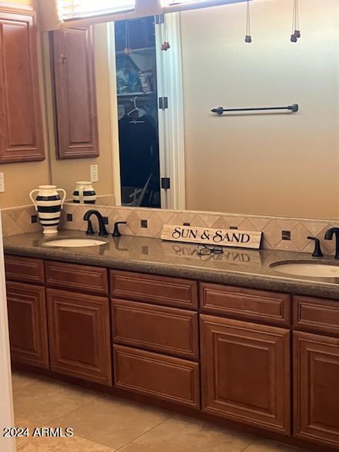 bathroom featuring tile patterned flooring and vanity