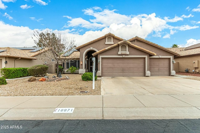 view of front of property featuring a garage