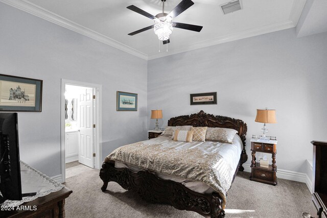 bedroom featuring ensuite bathroom, ceiling fan, light colored carpet, and ornamental molding