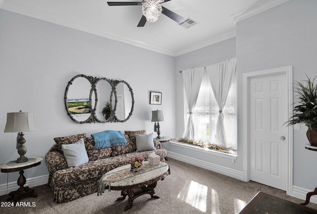 living room with ceiling fan, carpet floors, and crown molding