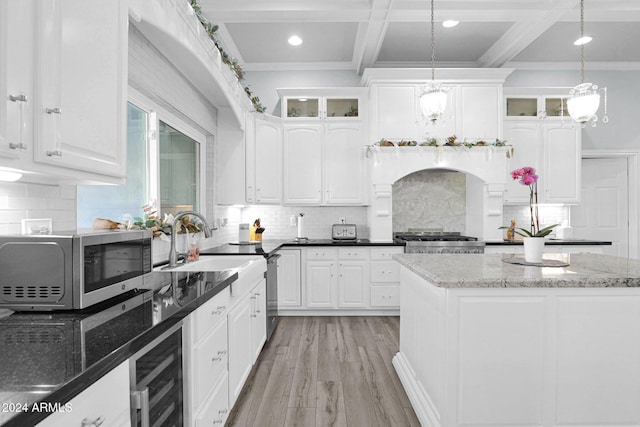 kitchen with pendant lighting and white cabinetry