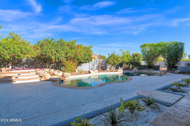 view of swimming pool featuring a patio area