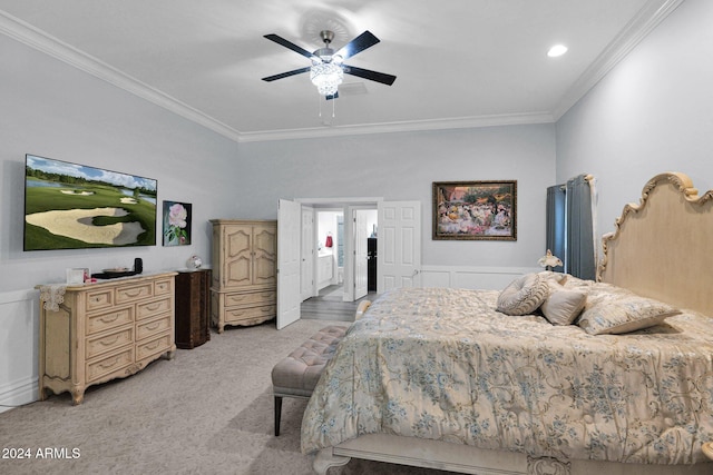 bedroom with ceiling fan, light colored carpet, and crown molding