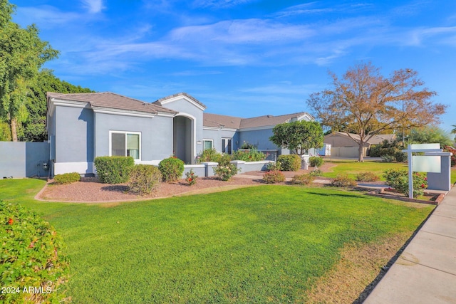 ranch-style house with a front yard