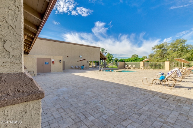 view of patio featuring a community pool