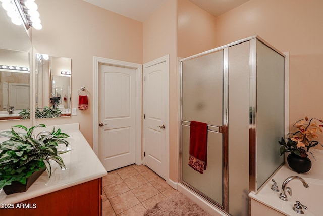 full bathroom with tile patterned floors, vanity, a bath, and a shower stall