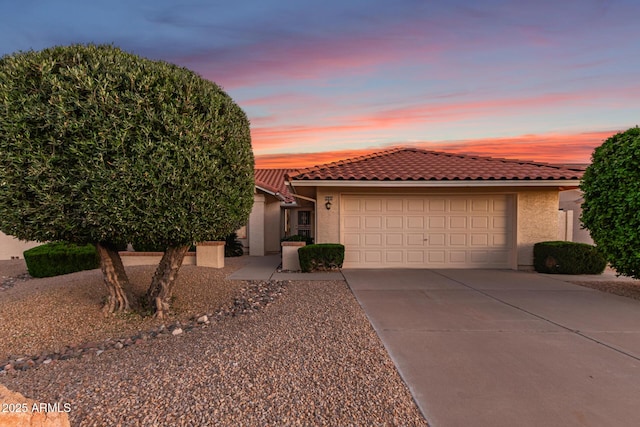 9809 W Behrend Dr, Peoria, AZ 85382 - view of front of home featuring concrete driveway, stucco siding, a tiled roof, and an attached garage