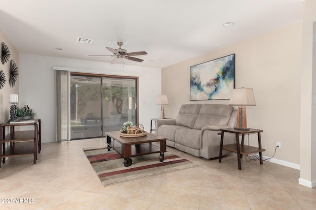 9809 W Behrend Dr, Peoria, AZ 85382 - living room featuring ceiling fan, baseboards, and light tile patterned floors