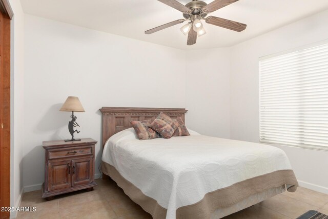 9809 W Behrend Dr, Peoria, AZ 85382 - bedroom featuring baseboards, light tile patterned floors, and ceiling fan