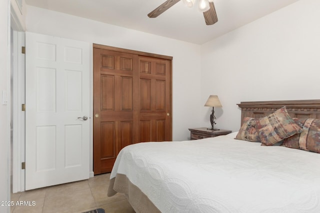 9809 W Behrend Dr, Peoria, AZ 85382 - bedroom featuring light tile patterned floors, a ceiling fan, and a closet
