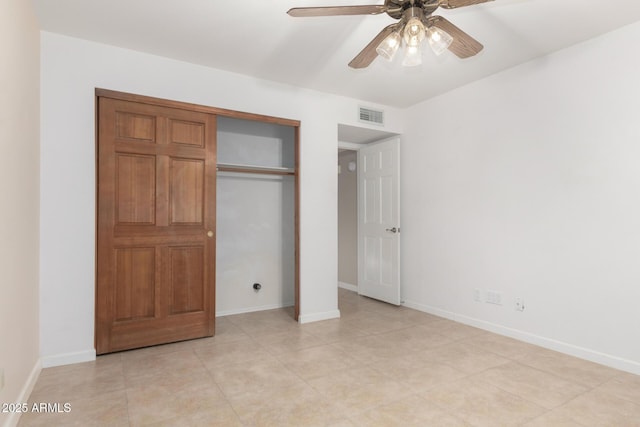 9809 W Behrend Dr, Peoria, AZ 85382 - unfurnished bedroom featuring a closet, baseboards, and light tile patterned floors