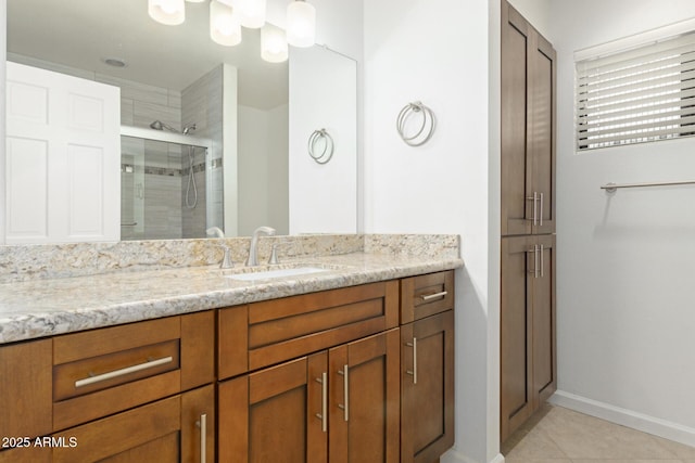 9809 W Behrend Dr, Peoria, AZ 85382 - bathroom with a shower stall, vanity, tile patterned floors, and baseboards