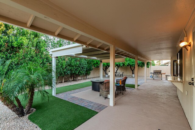 9809 W Behrend Dr, Peoria, AZ 85382 - view of patio / terrace with a fenced backyard, a grill, and a fire pit