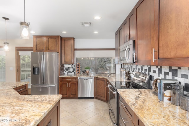 9809 W Behrend Dr, Peoria, AZ 85382 - kitchen with stainless steel appliances, tasteful backsplash, a sink, light tile patterned flooring, and light stone countertops