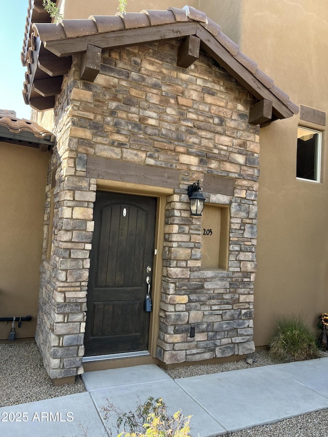 6145 E Cave Creek Rd Unit 203, Cave Creek, AZ 85331 - property entrance with stone siding