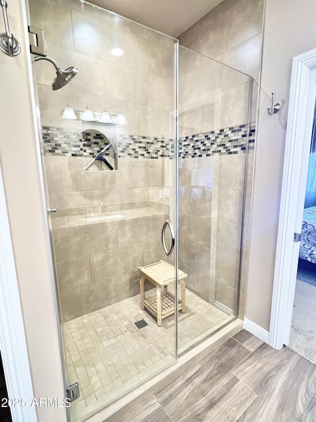 6145 E Cave Creek Rd Unit 203, Cave Creek, AZ 85331 - bathroom featuring a shower stall and wood finished floors