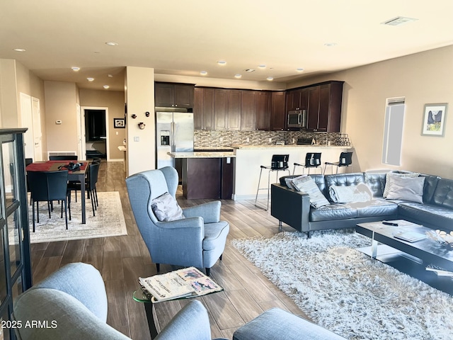 6145 E Cave Creek Rd Unit 203, Cave Creek, AZ 85331 - living room featuring recessed lighting and dark wood-type flooring