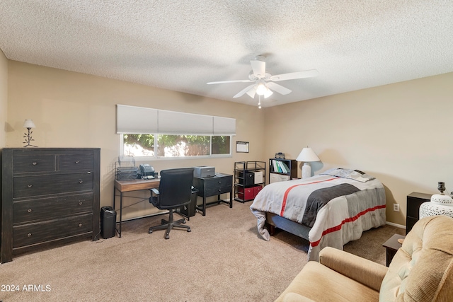 carpeted bedroom with a textured ceiling and ceiling fan