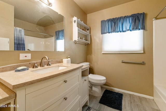 full bathroom with wood-type flooring, vanity, toilet, and shower / bath combo with shower curtain