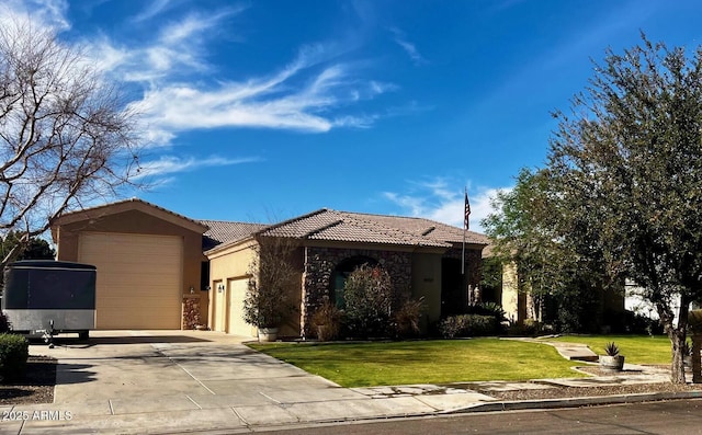 view of front of home featuring a garage and a front yard