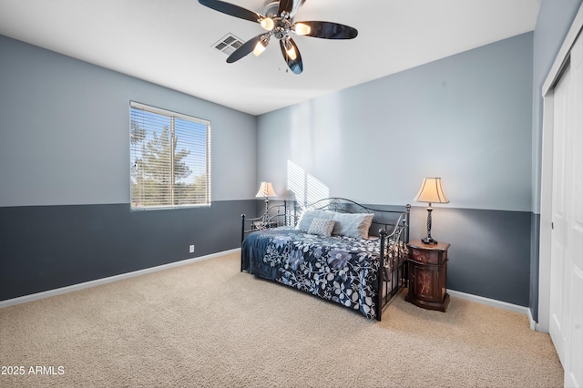 bedroom with carpet floors, a closet, and ceiling fan